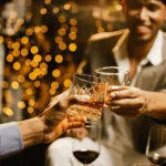 happy-two-man-clinking-glasses-600nw-2557811171